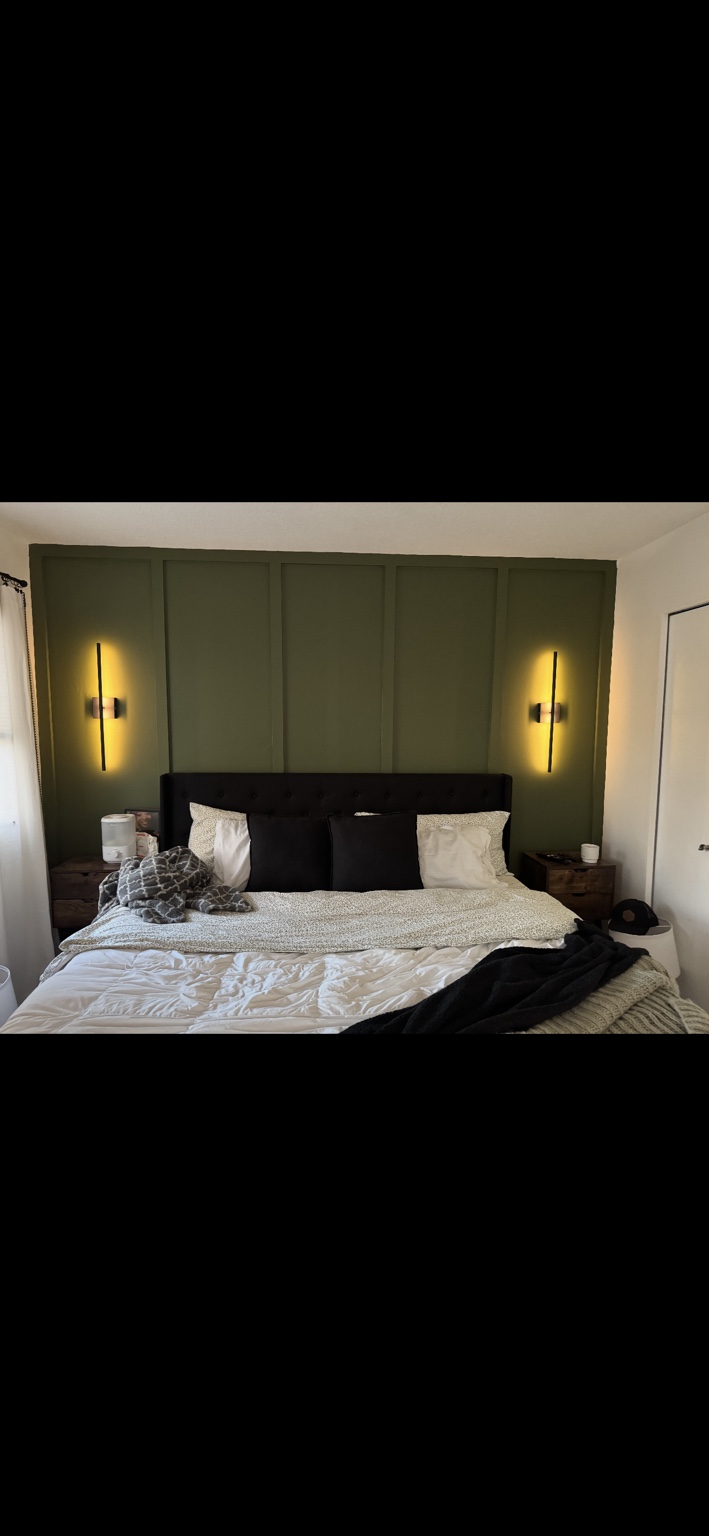 Green custom board and batten accent wall by The Worksmith Accents