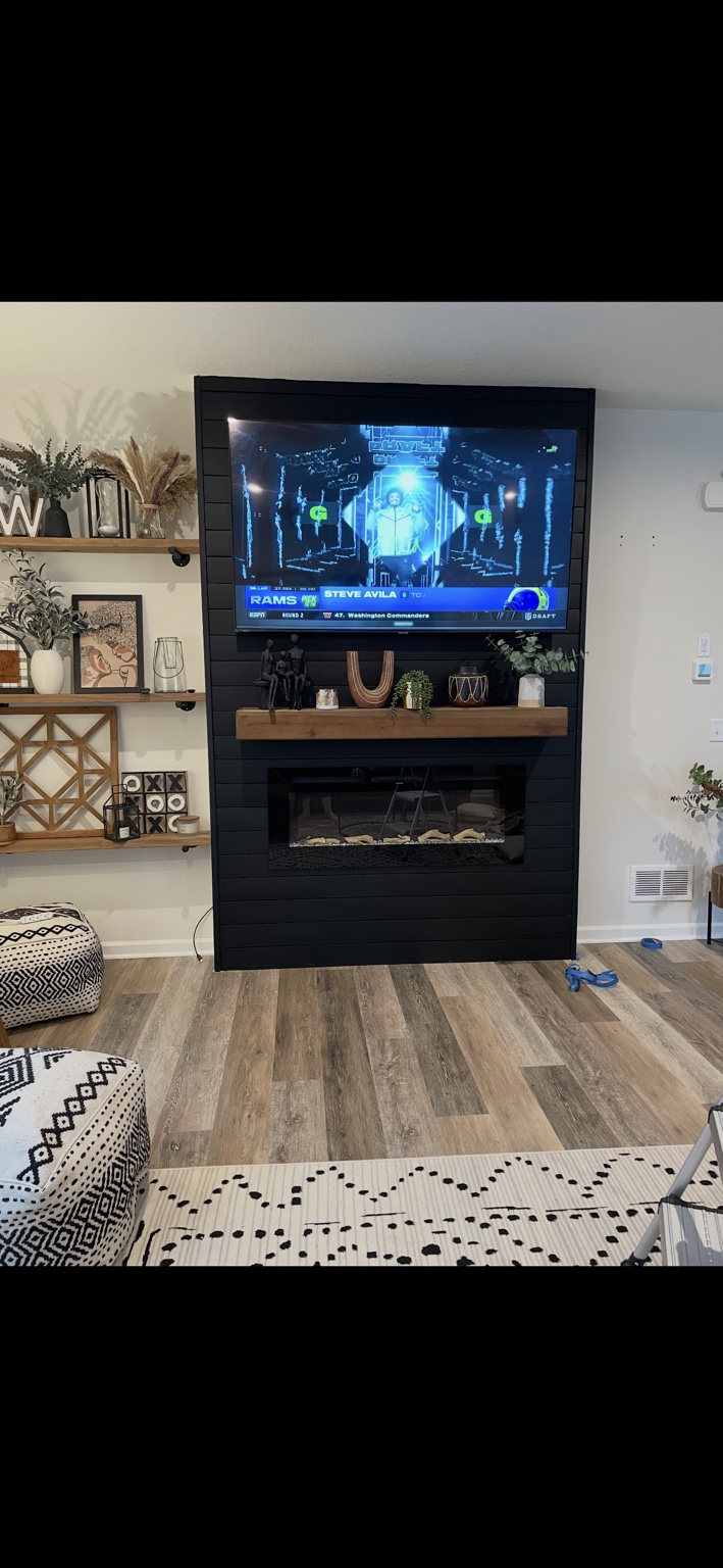 Black fireplace and TV feature wall